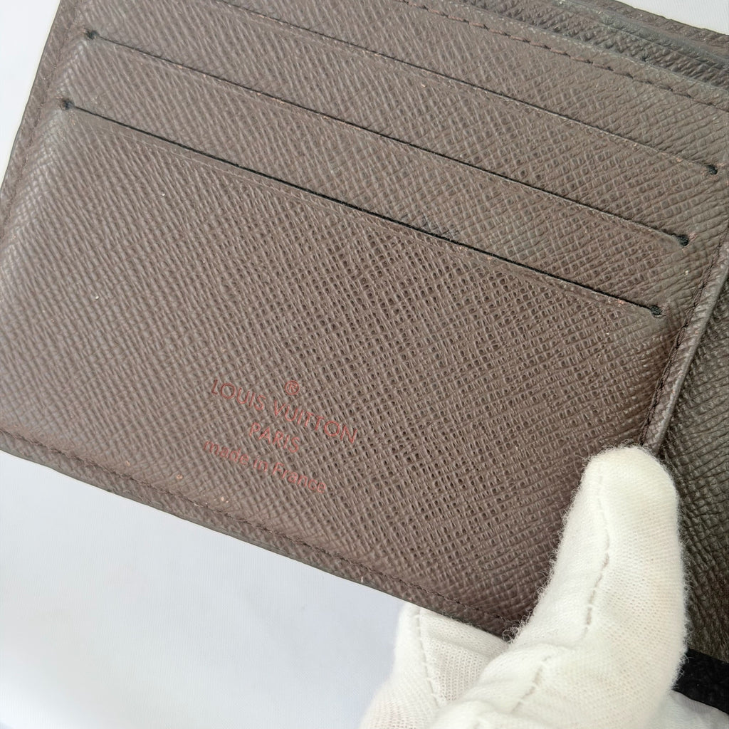 Louis Vuitton Bifold wallet Damier Ebène Coated Canvas Brown Repaired