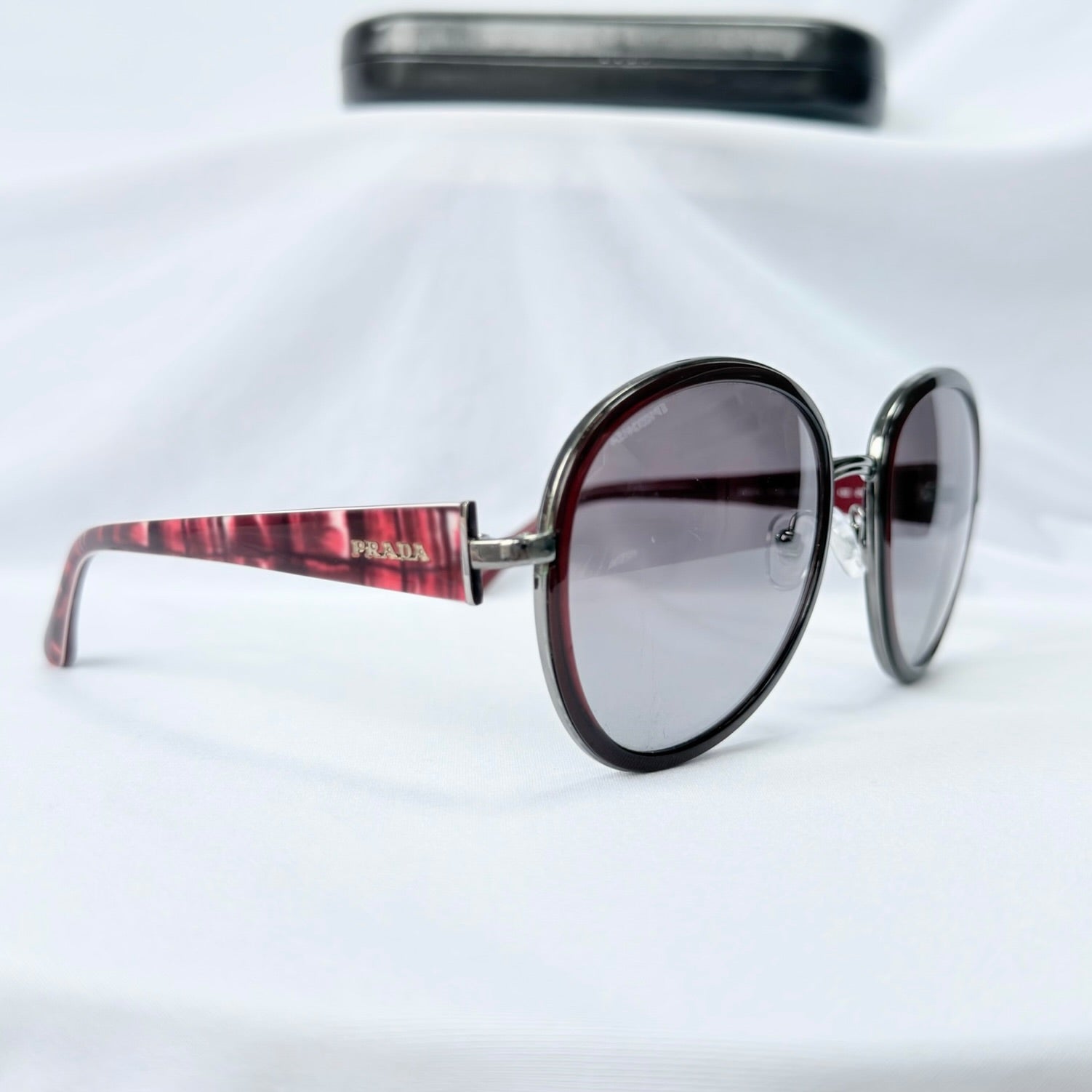 Prada SPR 51N Burgundy Red Striped Arms Oversized Oval Round Women’s Sunglasses