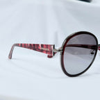 Prada SPR 51N Burgundy Red Striped Arms Oversized Oval Round Women’s Sunglasses