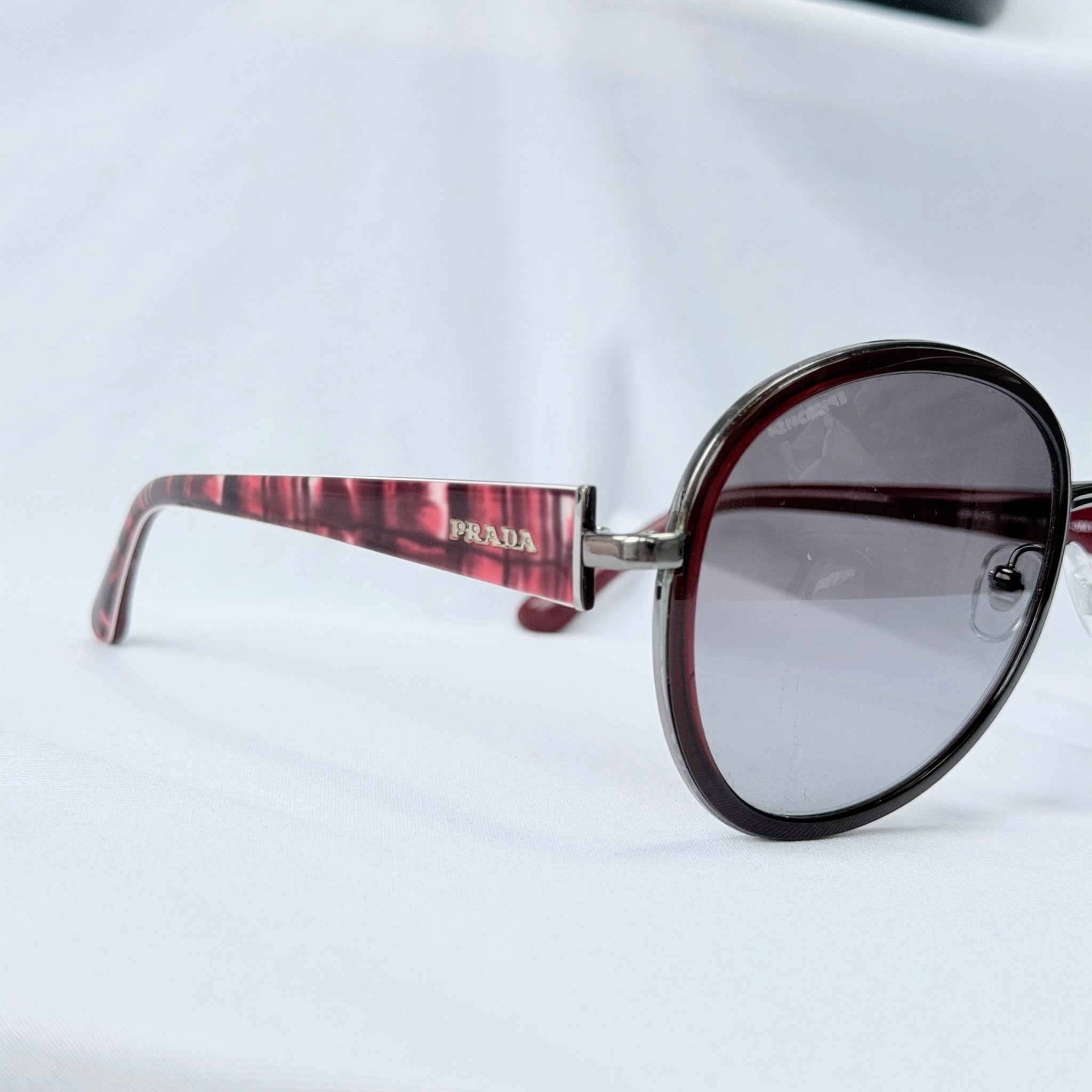 Prada SPR 51N Burgundy Red Striped Arms Oversized Oval Round Women’s Sunglasses