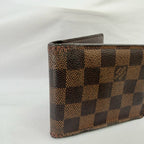 Louis Vuitton Bifold wallet Damier Ebène Coated Canvas Brown Repaired