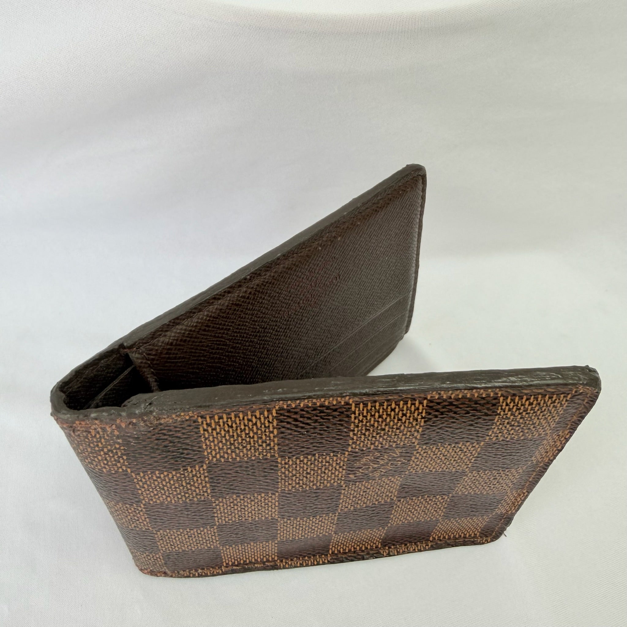 Louis Vuitton Bifold wallet Damier Ebène Coated Canvas Brown Repaired