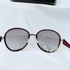 Prada SPR 51N Burgundy Red Striped Arms Oversized Oval Round Women’s Sunglasses