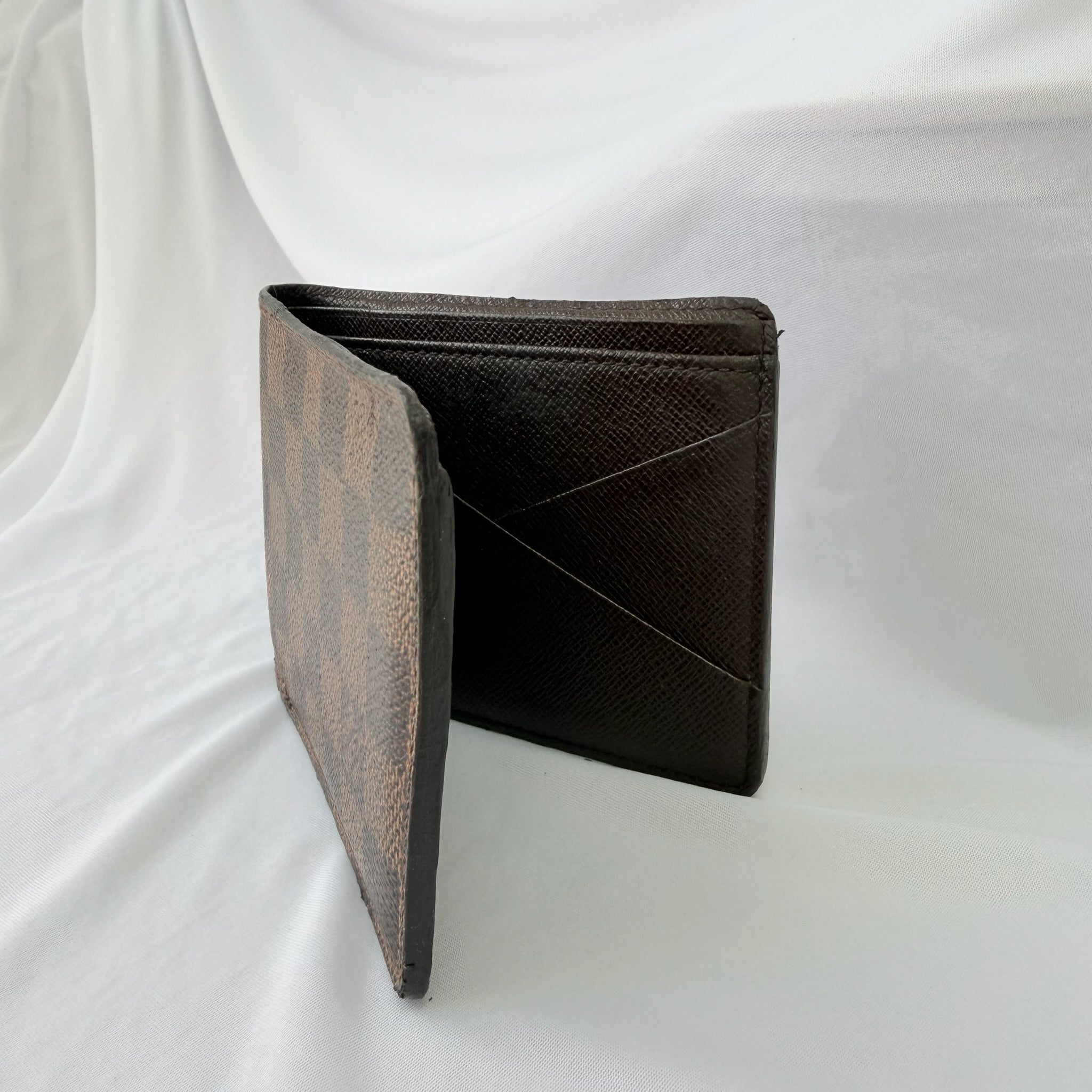 Louis Vuitton Bifold wallet Damier Ebène Coated Canvas Brown Repaired
