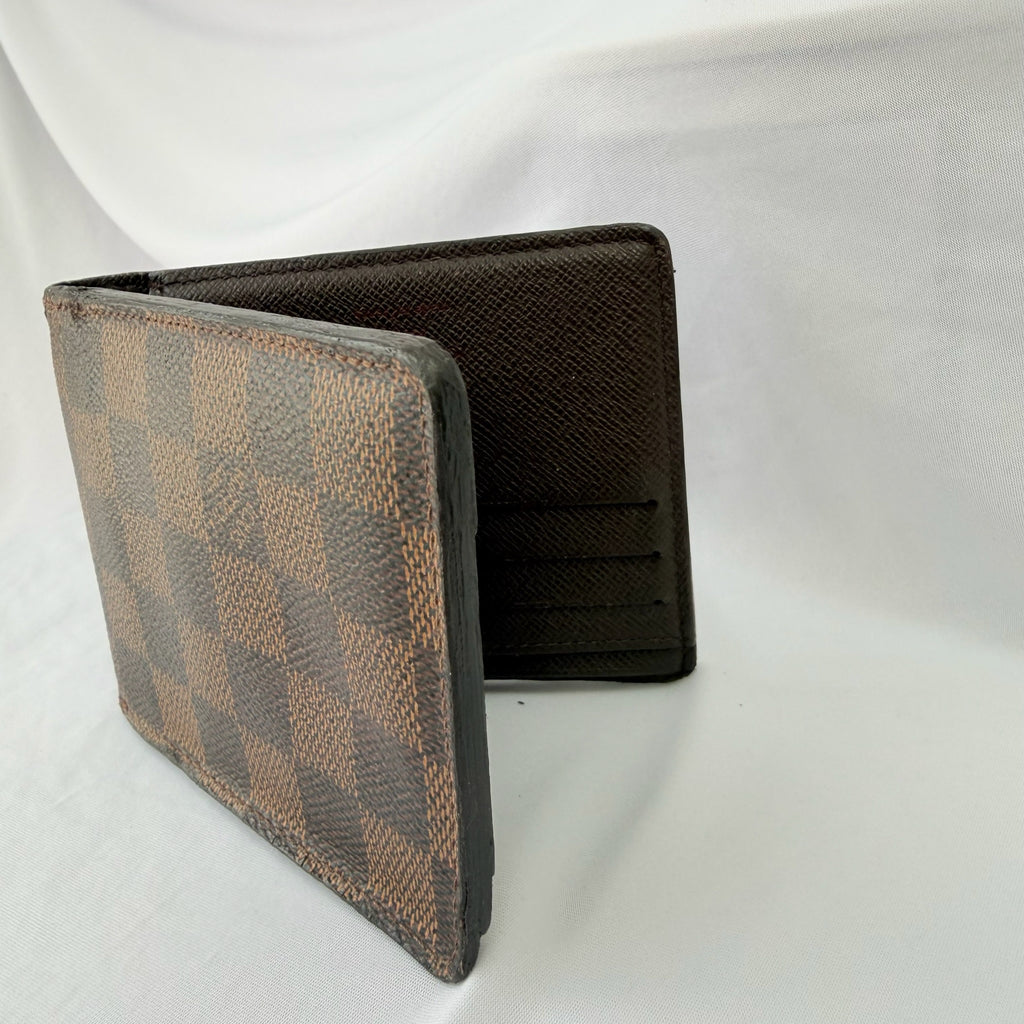 Louis Vuitton Bifold wallet Damier Ebène Coated Canvas Brown Repaired